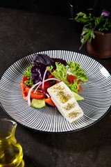Authentic Greek Salad with Feta Cheese on a Stylish Black Plate