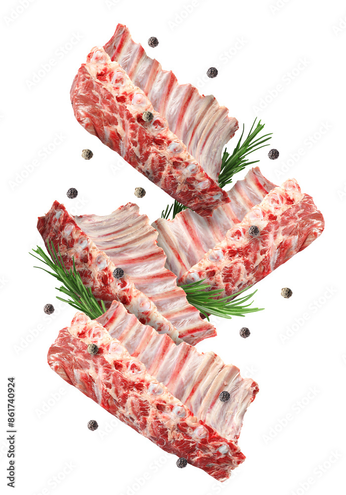 Wall mural Raw ribs, rosemary and peppercorns in air isolated on white