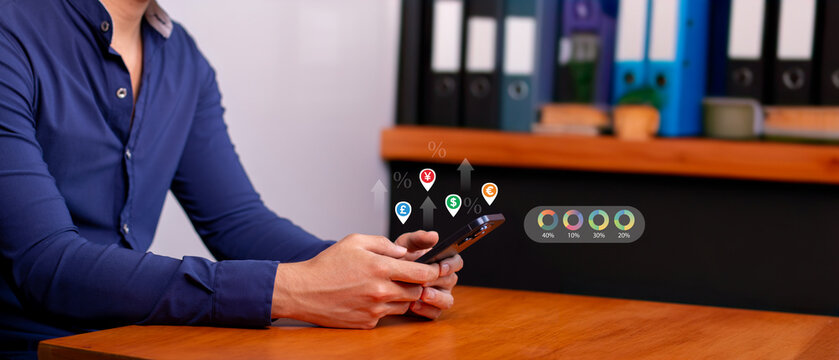 business concepts: businessman invests in international currency from his smart phone