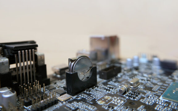 Battery-backed electronic circuit card. 3 Volts lithium cell on the motherboard to feed the configuration memory and real time clock of the device. Focused on the battery.