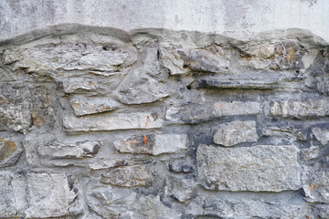 Stone wall detail. Grey brick background 