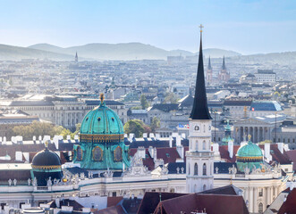 Vienna cityscape on sunny day with Hofburg dome