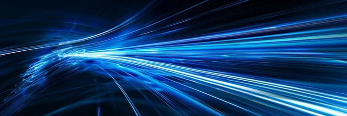 A high-speed motion capture image showcasing vibrant blue light rays streaking across a dark background, creating a sense of speed and energy