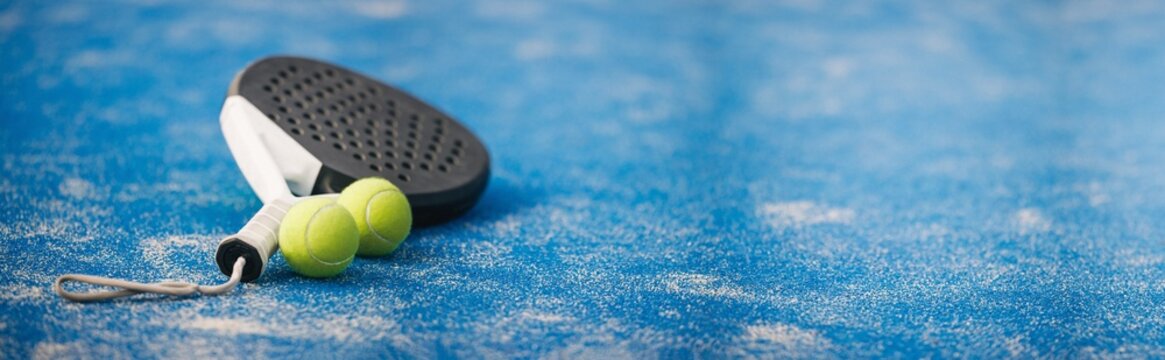 Blue padel court with training equipment and sports essentials