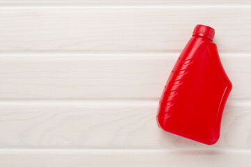 Machine oil on wooden background, top view