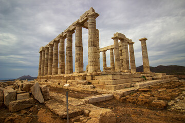 The ancient ruin of Poseidon, Cape of Sounion with cloudy weather near Athens, Greece.