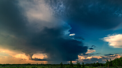 Beautiful sky over a field after a summer thunderstorm.
