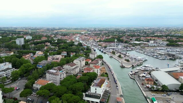 ITALY, 24 June 2024: aerial and panoramic view in 4k of Cesenatico with its beach, its sea and its canal with historic boats. We are on the Romagna coast in the province of Rimini
