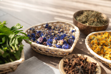 Bowls with dried flowers. Preparation for the practice of creating a mandala from flowers. 