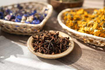 Bowls with dried flowers. Preparation for the practice of creating a mandala from flowers. 