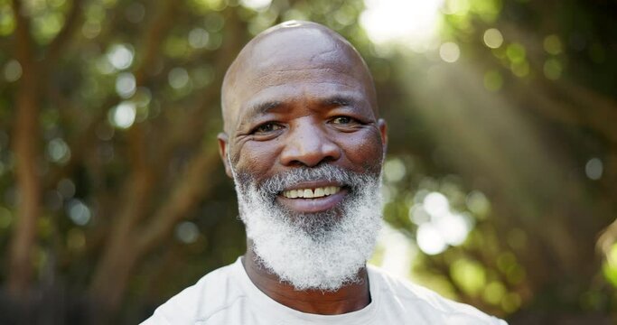 Senior black man, fitness and face in park with smile for training, health or progress to lose weight. African person, runner and happy in portrait for exercise, workout or wellness on path in garden