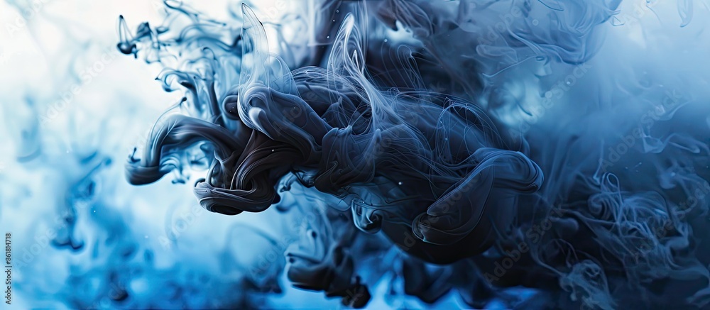 Poster blue and black ink swirling underwater, creating a colored abstract smoke explosion effect on a whit