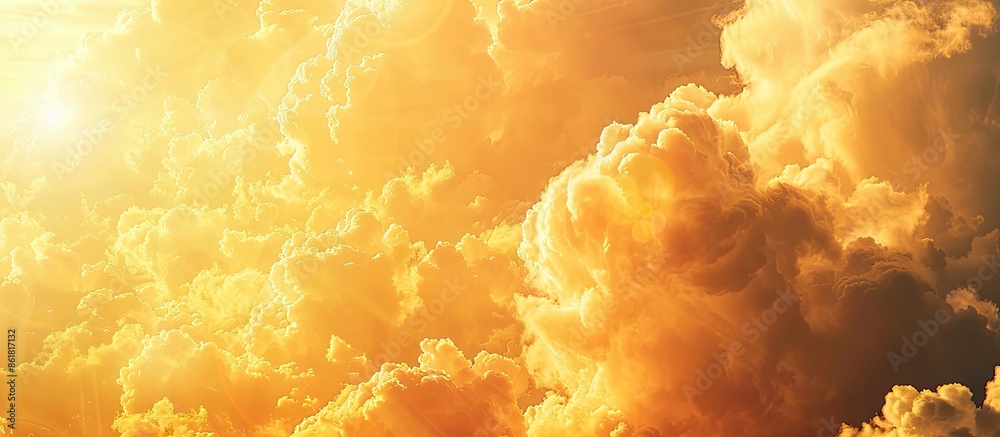 Poster the sunlight transforms the clouds into shades of orange and yellow, creating a serene and picturesq