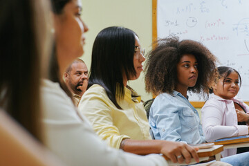 Group of students concentrated in the classroom paying attention to a difficult subject.