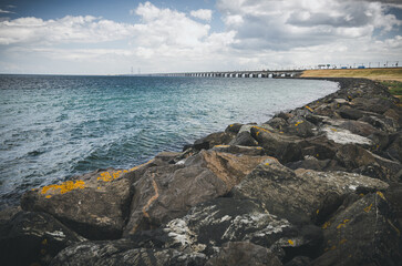 Rock and lake with Øresund bridge in the background