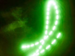 green abstract background with circular streams of white light