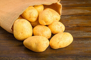 Potato Sack on Dark Rustic Wood Surface