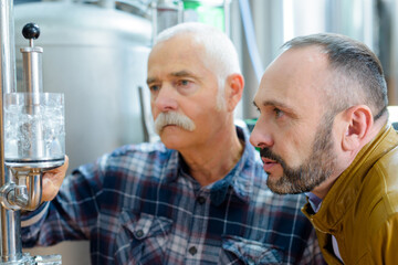 portrait of concentrated men in brewery