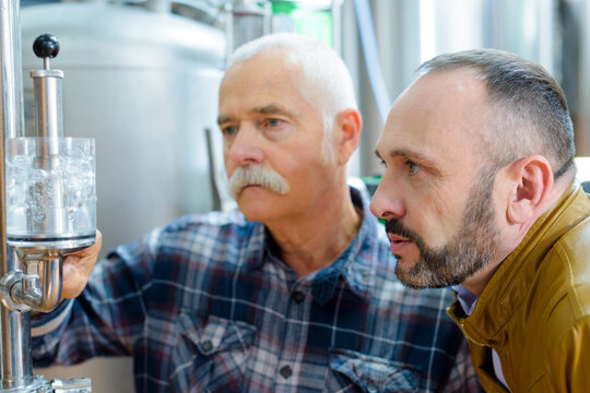 portrait of concentrated men in brewery