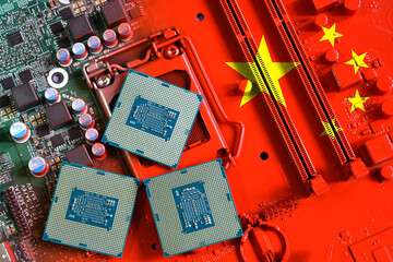Flag of the Republic of China on a red painted pc motherboard with a CPU. Concept for supremacy in...