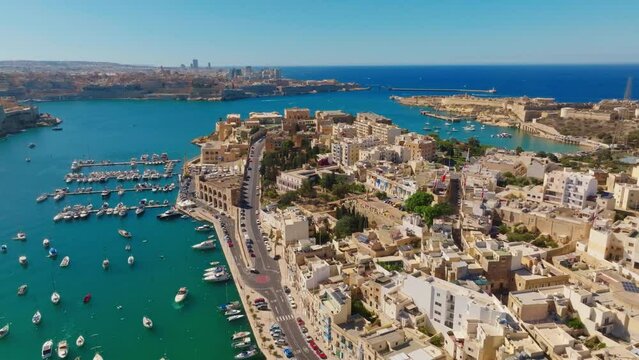 Drone view of cities, marina, boats, yachts, sea, road. Maltese island