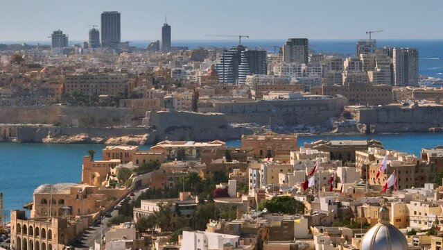 Drone view of maltese buildings, constructions, architecture, towers, city. Malta island