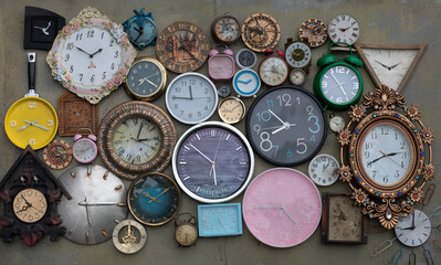 vintage collection of wall clocks and alarm clocks
