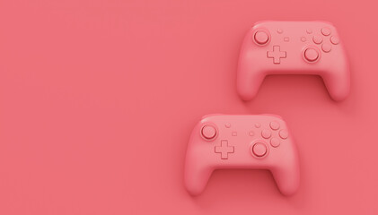 Video game joysticks or gamepads in plain monochrome pink color background © Vasyl Onyskiv