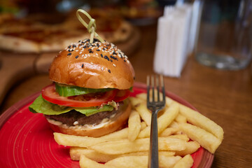 Delicious Gourmet Burgers beautifully presented on a Wooden Board at a Restaurant