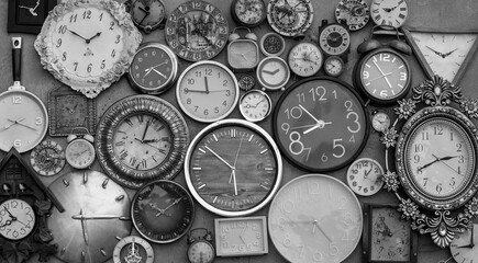 vintage collection of wall clocks and alarm clocks