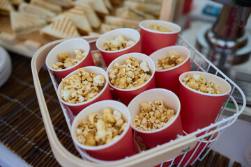 Popcorn in cups can boost enjoyment at movie nights or parties with an extra touch of delight