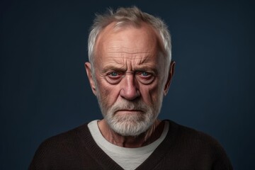 Obraz premium Senior man with grey hair standing over isolated background skeptic and nervous, frowning upset because of problem. negative emotions. Extremely Sulking Caucasian senior man, half body portrait