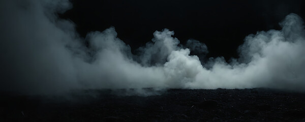 Fototapeta premium Thick white smoke billowing against a dark background. Perfect for creating atmosphere in horror, mystery, or dramatic designs.