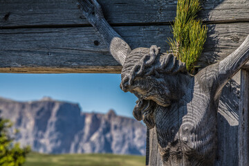 weathered wooden cross on seiser alm 