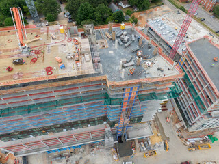 Obraz premium Daytime Drone Images of Highrise Construction and the Skyline in Downtown Raleigh North Carolina. Industry, Architecture, Engineering