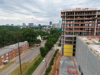 Fototapeta premium Daytime Drone Images of Highrise Construction and the Skyline in Downtown Raleigh North Carolina. Industry, Architecture, Engineering