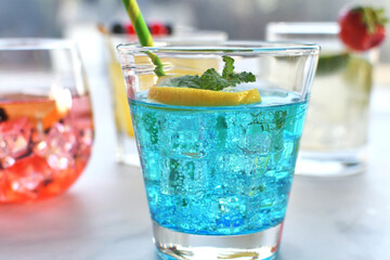 Colorful tropical drinks, brightly colored assorted summer cocktails.