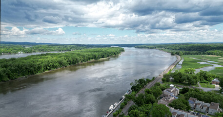 view of the hudson river and catskills mountains from a park in hudson new york valley (lighthouse, water clouds harbor coastline scene) aerial beautiful travel destination ny state public land