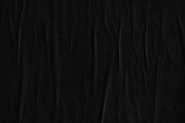 Dark black creased crumpled paper background surface old posters grunge texture backdrop surface...