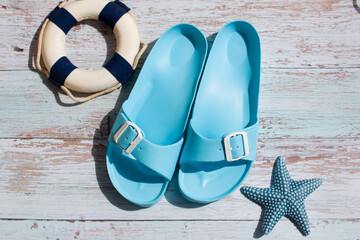 Naklejka premium women's flip-flops, summer shoes for the beach. For a walk in summer
