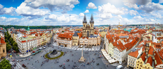 Panoramic view over the old town of Prague, Czech Republic, with Tyn Church and crowded old town square during a sunny summer day © moofushi