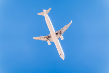 Airplane before landing in blue sky, Airbus A321-200