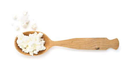 Spoon of tasty cottage cheese on white background