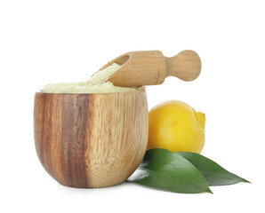 Bowl of lemon body scrub with scoop isolated on white background