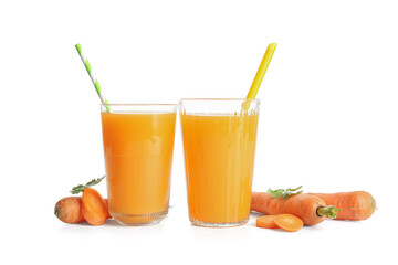 Glasses of fresh carrot juice with parsley on white background