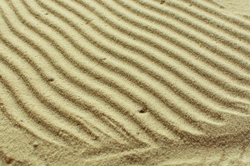 textured sand background, beautiful sand texture, overhead view of sand, zen pattern drawn in the sand, Top view of fine grain texture