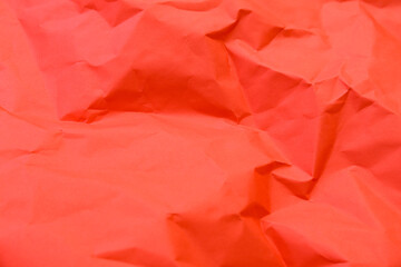 Fototapeta premium Closeup view of red crumpled paper texture as background