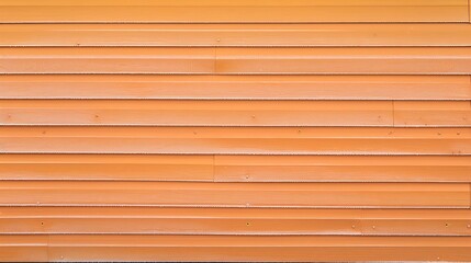 detailed view of vinyl siding in a soft apricot orange, with the morning frost highlighting its warm tones and durability against the elements