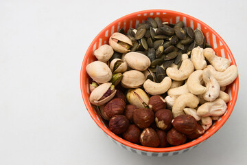 Mixture of nuts such as hazelnuts, sunflower seeds, pistachios and cashews in a bowl