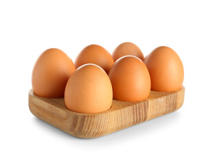 Wooden holder with raw chicken eggs on white background